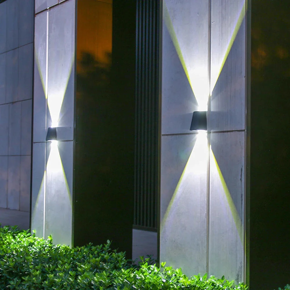 Solar wall light casting beams on a modern wall